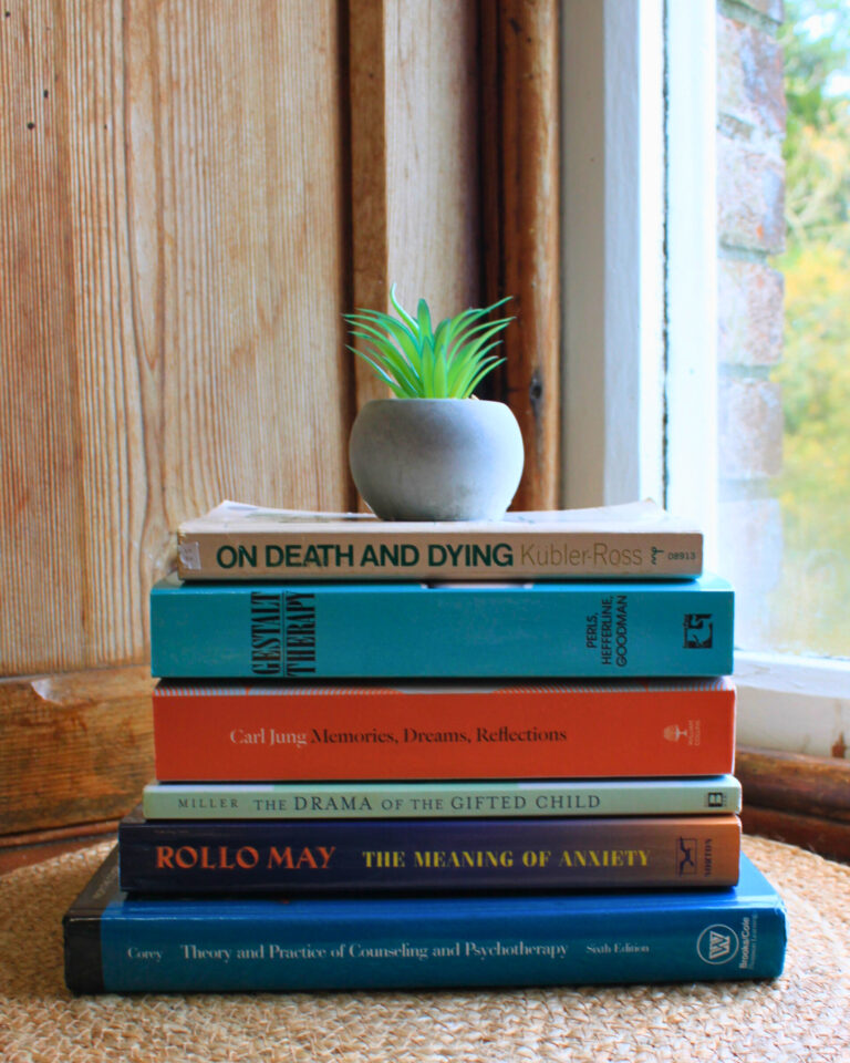 Pile of books in my psychotherapy and counselling practice room in Tralee, North Kerry